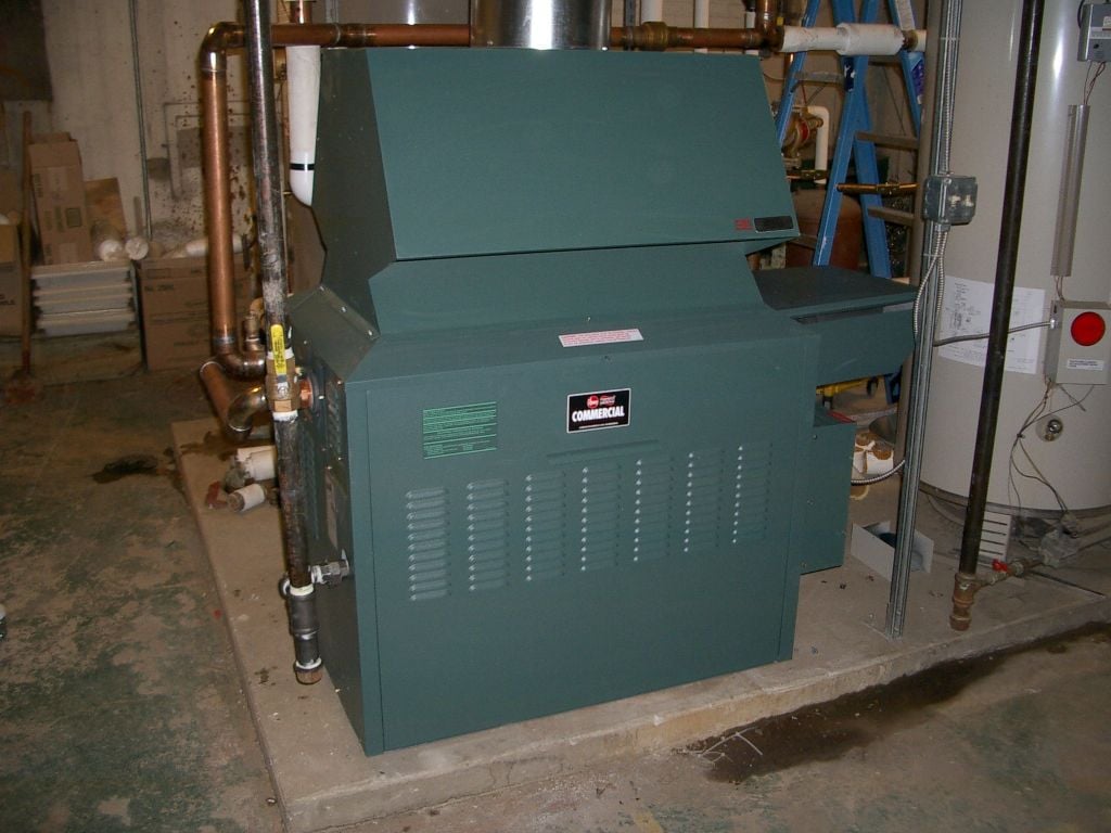 TCS HVAC technicians servicing a commercial HVAC unit in Western Pennsylvania